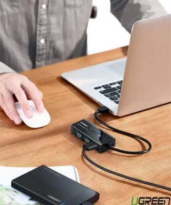 Hub USB 3.0 Ugreen 20265 kết nối laptop với ổ cứng ngoài và chuột, mở rộng cổng tiện lợi cho văn phòng